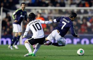 cristiano-ronaldo-624-being-tackled-by-ever-banega-in-valencia-vs-real-madrid-in-2013.jpg